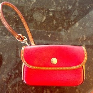 Red authentic Dooney & Bourke wristlet.